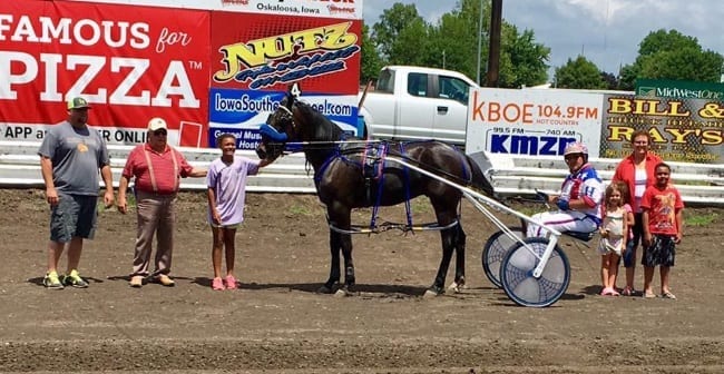 Jimmy Freight and his Iowa connections after setting a 1:58.1 track record on the half-mile oval at the Keokuk County Fair in What Cheer, IA on July 8. On Wednesday, owner Adriano Sorella paid "high six figures" to acquire the undefeated son of Sportswriter | Courtesy Adriano Sorella